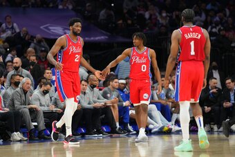 PHILADELPHIA, PA - MARCH 02: Joel Embiid #21, Tyrese Maxey #0, and James Harden #1 of the Philadelphia 76ers react against the New York Knicks in the second half at the Wells Fargo Center on March 2, 2022 in Philadelphia, Pennsylvania. The 76ers defeated 