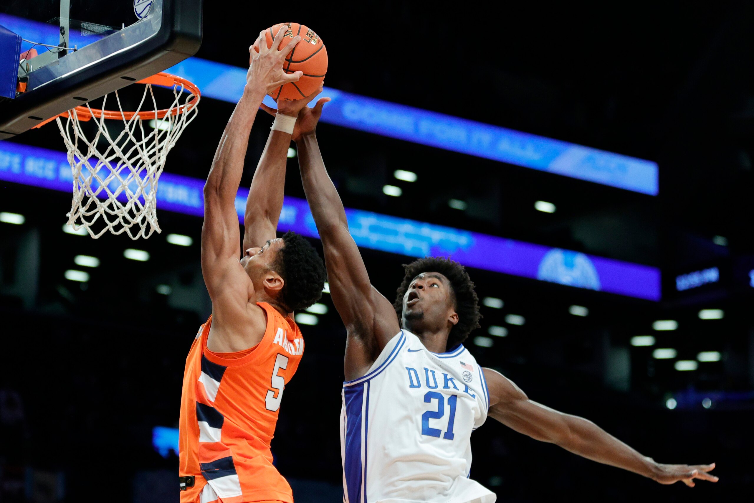 NEW YORK, NEW YORK - MARCH 10: Frank Anselem #5 of the Syracuse Orange goes to the basket as AJ Griffin #21 of the Duke Blue Devils defends during the first half in the 2022 Men's ACC Basketball Tournament - Quarterfinals at Barclays Center on March 10, 2