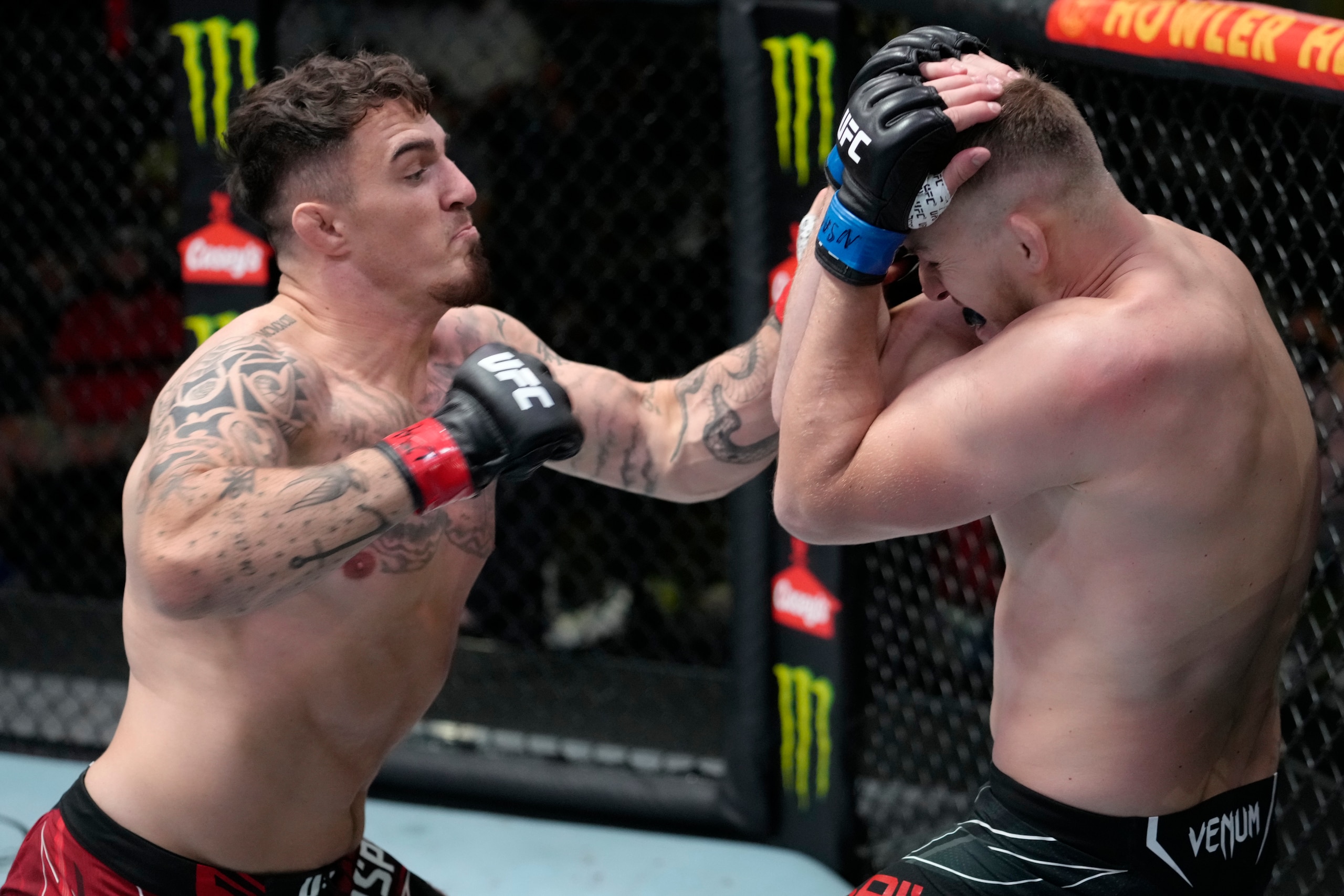 LAS VEGAS, NEVADA - SEPTEMBER 04: In this handout image provided by UFC, (L-R) Tom Aspinall of England punches Serghei Spivak of the Ukraine in their welterweight fight during the UFC Fight Night event at UFC APEX on September 04, 2021 in Las Vegas, Nevad