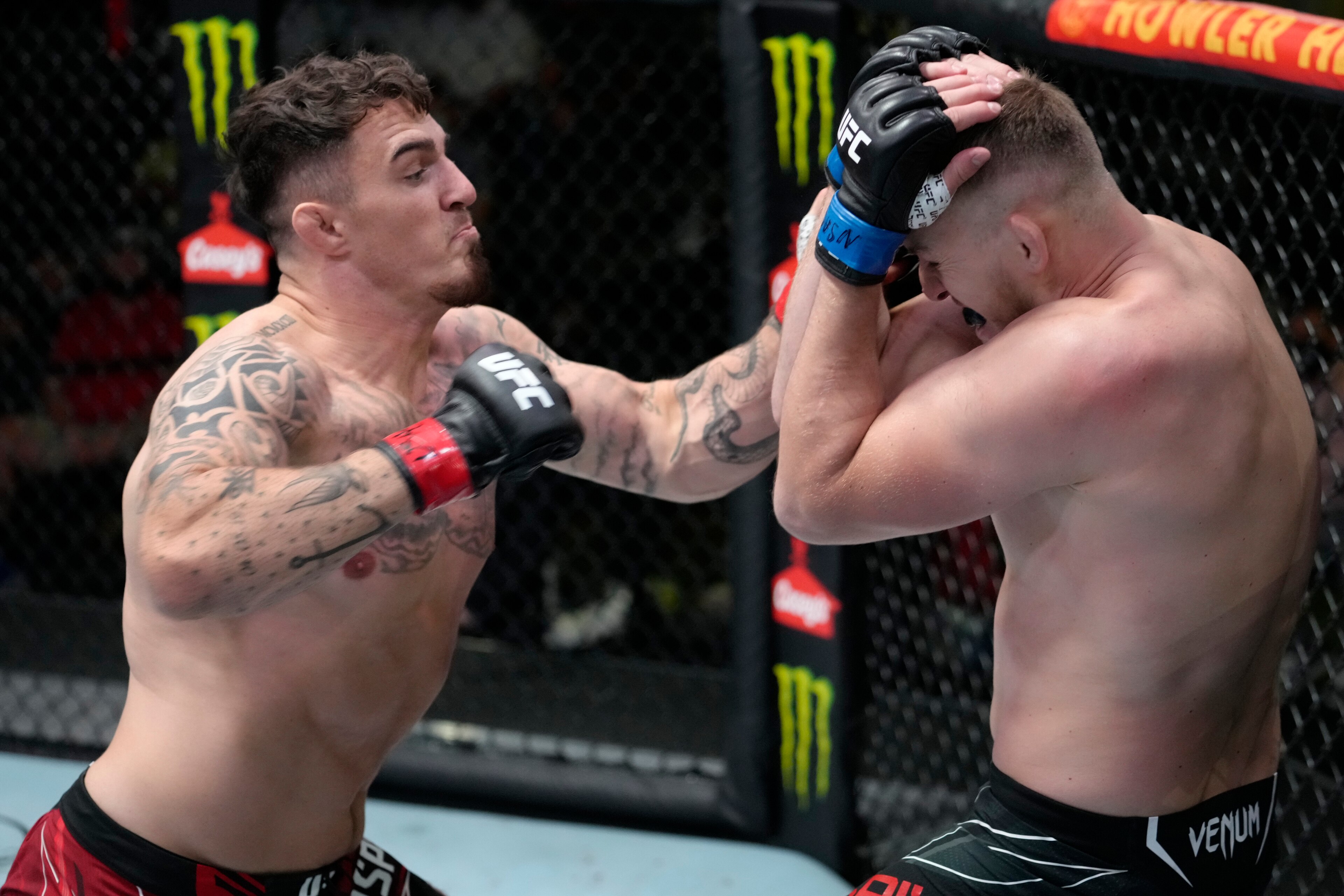 LAS VEGAS, NEVADA - SEPTEMBER 04: In this handout image provided by UFC, (L-R) Tom Aspinall of England punches Serghei Spivak of the Ukraine in their welterweight fight during the UFC Fight Night event at UFC APEX on September 04, 2021 in Las Vegas, Nevad
