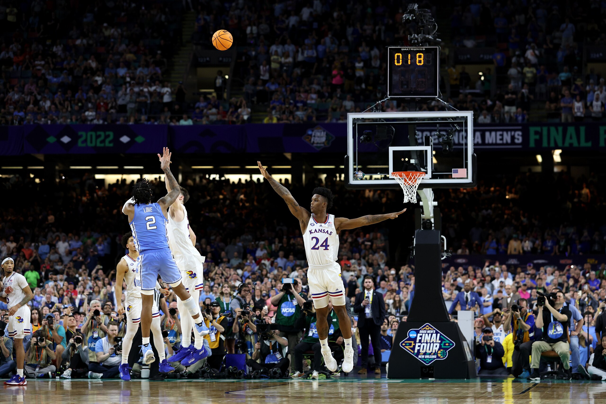 NEW ORLEANS, LOUISIANA - APRIL 04: Christian Braun #2 of the Kansas Jayhawks attempts to block a shot by Caleb Love #2 of the North Carolina Tar Heels in the second half of the game during the 2022 NCAA Men's Basketball Tournament National Championship at