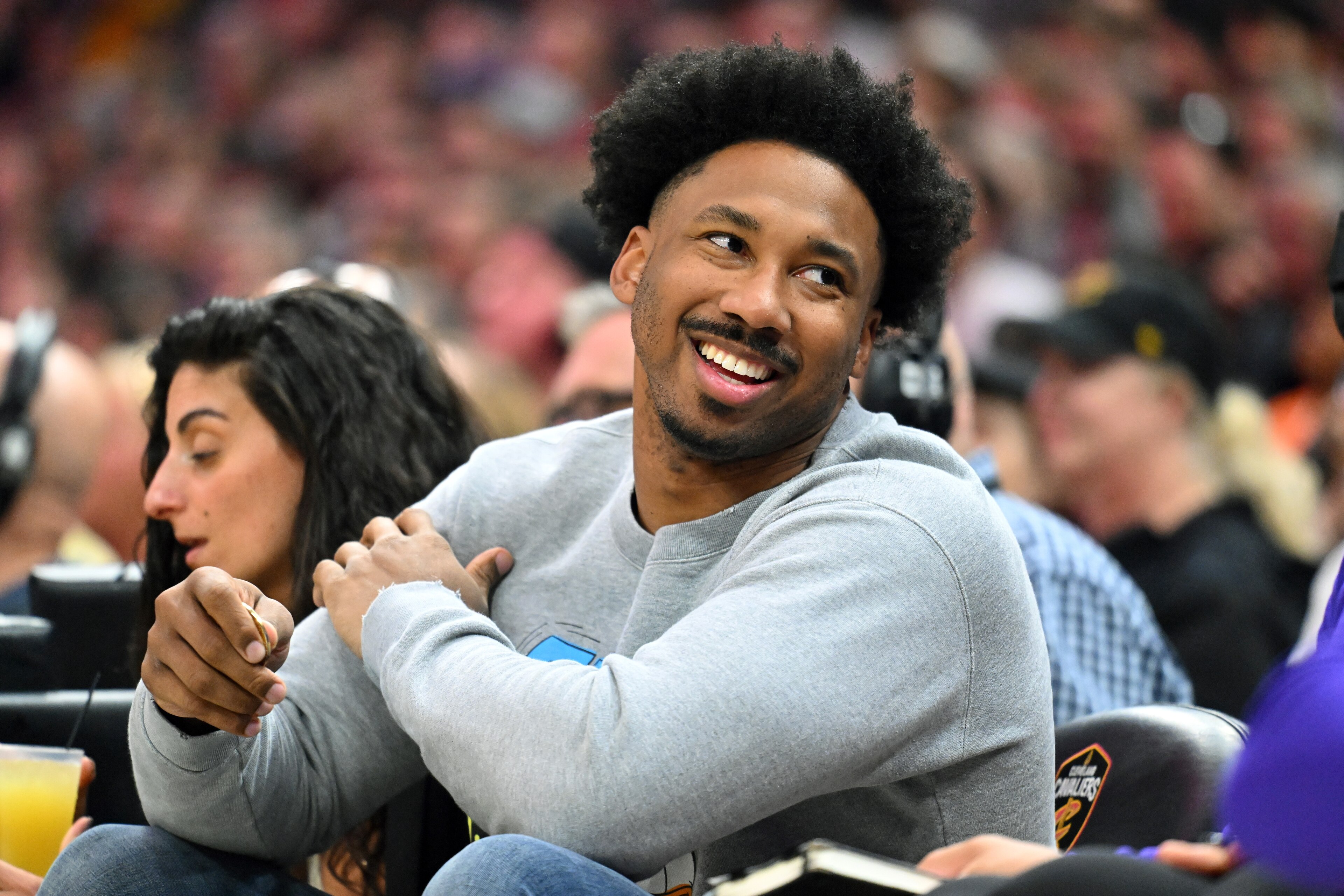 CLEVELAND, OHIO - MARCH 21: Cleveland Browns defensive end Myles Garrett talks to a fan during the second quarter of the game between the Cleveland Cavaliers and the Los Angeles Lakers at Rocket Mortgage Fieldhouse on March 21, 2022 in Cleveland, Ohio. NO