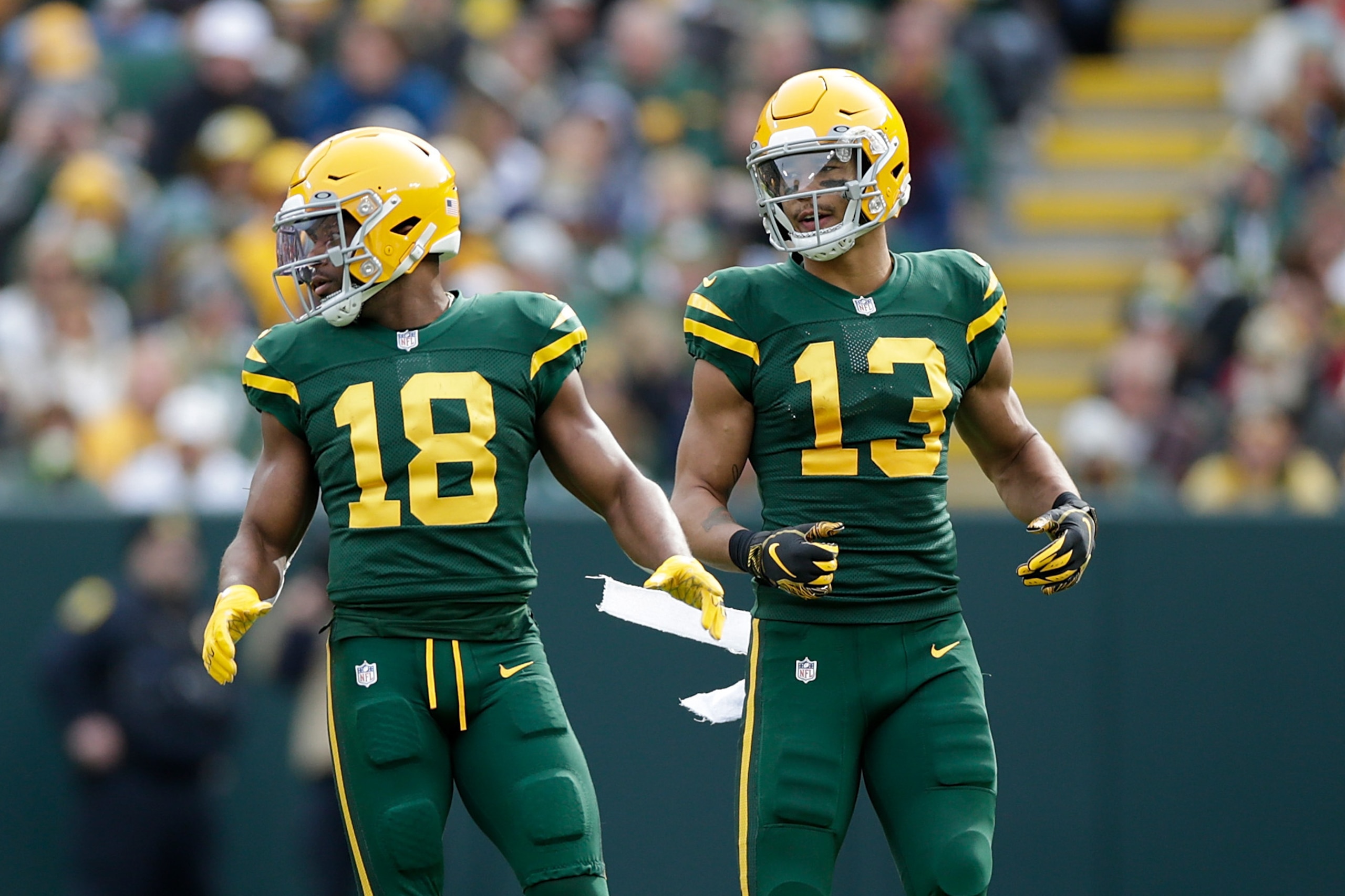 GREEN BAY, WISCONSIN - OCTOBER 24: Davante Adams #17, Randall Cobb #18 and Allen Lazard #13 of the Green Bay Packers line up before the snap against the Washington Football Team at Lambeau Field on October 24, 2021 in Green Bay, Wisconsin. Green Bay defea GREEN BAY, WISCONSIN - OCTOBER 24: Davante Adams #17, Randall Cobb #18 and Allen Lazard #13 of the Green Bay Packers line up before the snap against the Washington Football Team at Lambeau Field on October 24, 2021 in Green Bay, Wisconsin. Green Bay defea