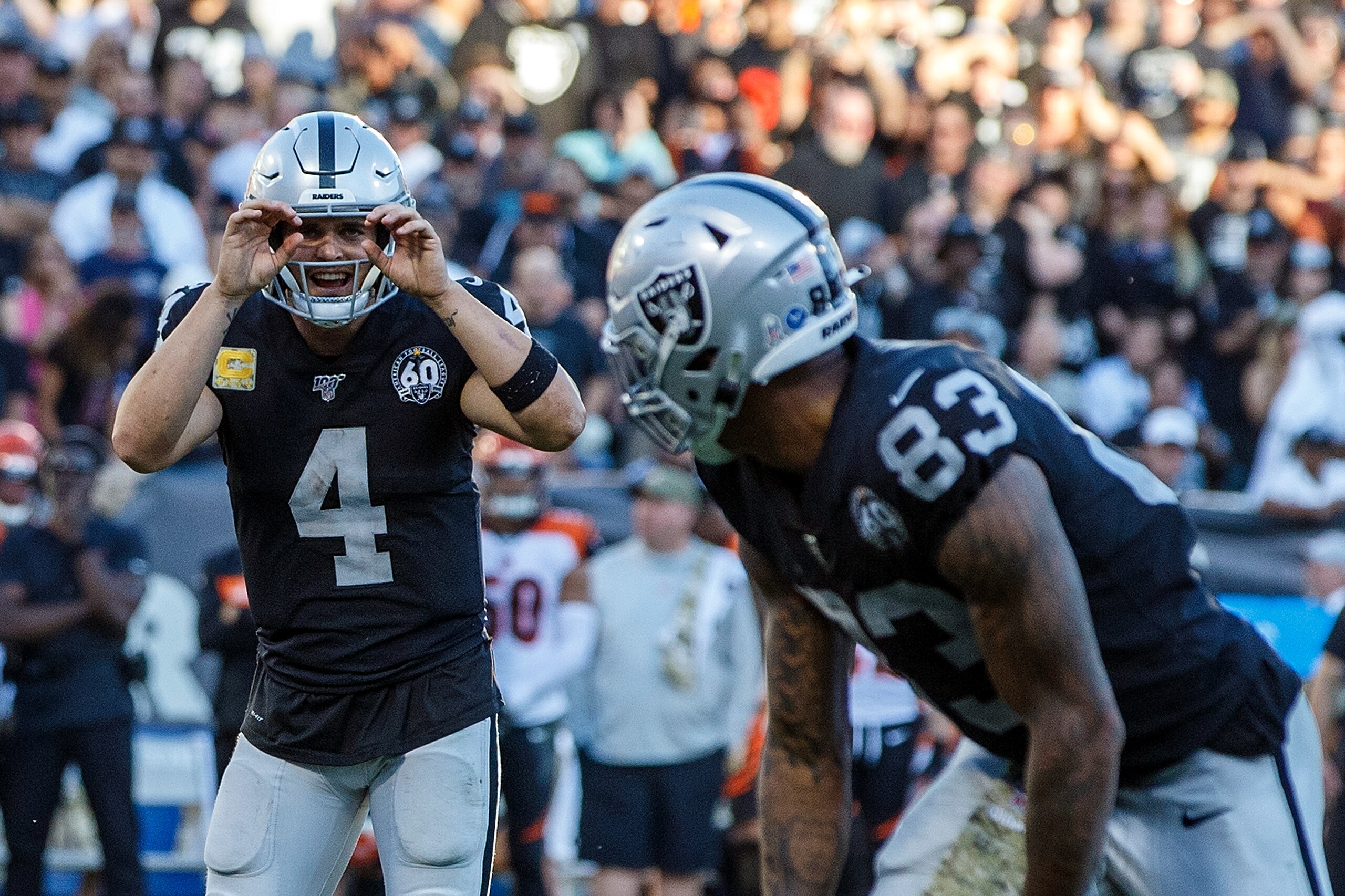 OAKLAND, CA - NOVEMBER 17: Quarterback Derek Carr #4 of the Oakland Raiders signals to tight end Darren Waller #83 during the fourth quarter against the Cincinnati Bengals at RingCentral Coliseum on November 17, 2019 in Oakland, California. The Oakland Ra