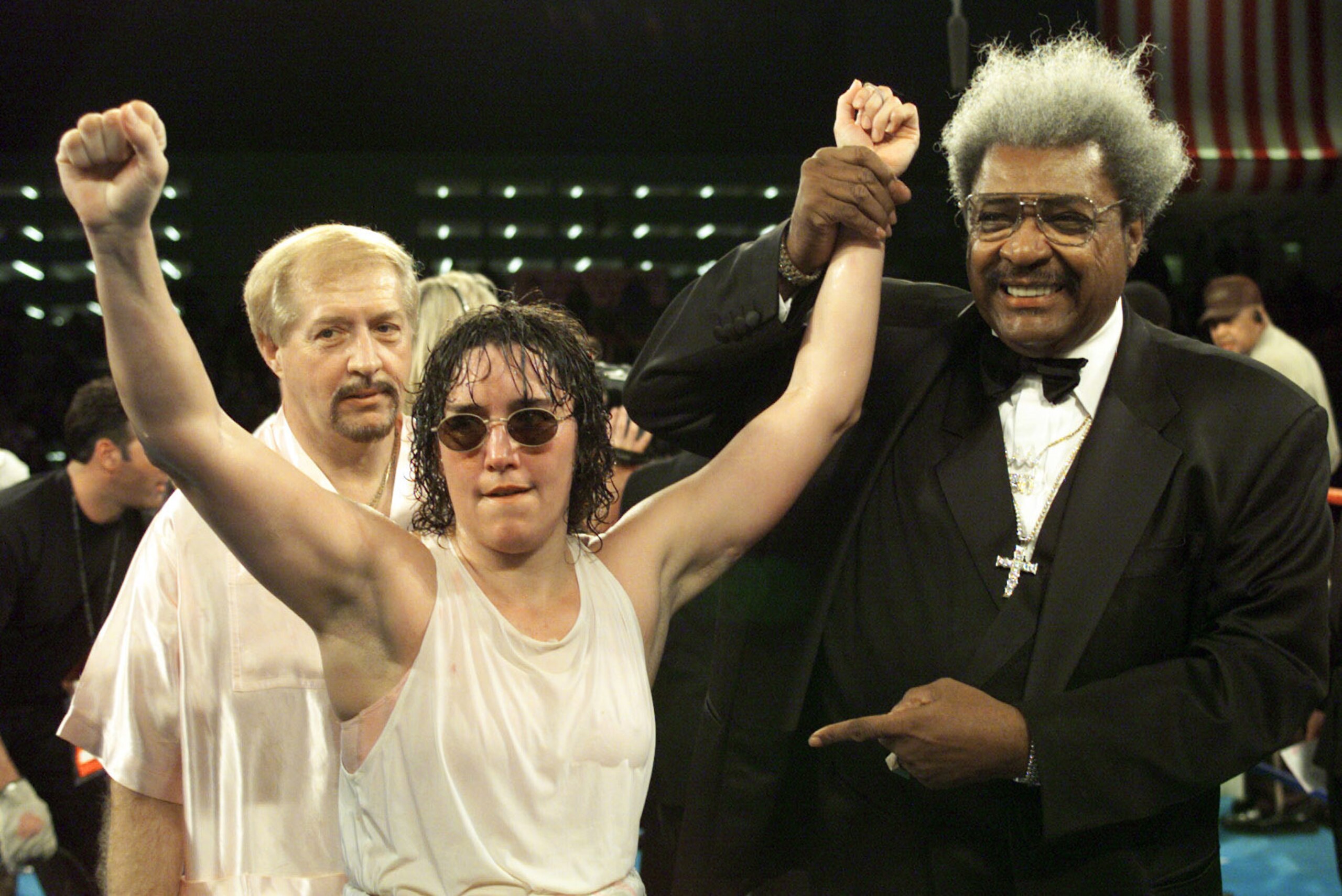 3 Mar 2000:  Promoter Don King holds up the arm of Christy Martin after defeating Belinda Laracuente by way of unanimous decision after 8 rounds during their Women''s WBC Championship bout at Caesars Palace in Las Vegas, Nevada.  <<DIGITAL IMAGE>>   Manda