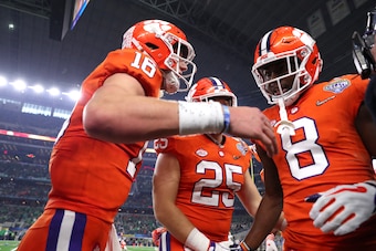 ARLINGTON, TEXAS - DECEMBER 29: Trevor Lawrence #16 and Justyn Ross #8 of the Clemson Tigers react after connecting on a 42 yard touchdown pass in the second quarter against the Notre Dame Fighting Irish during the College Football Playoff Semifinal Goody