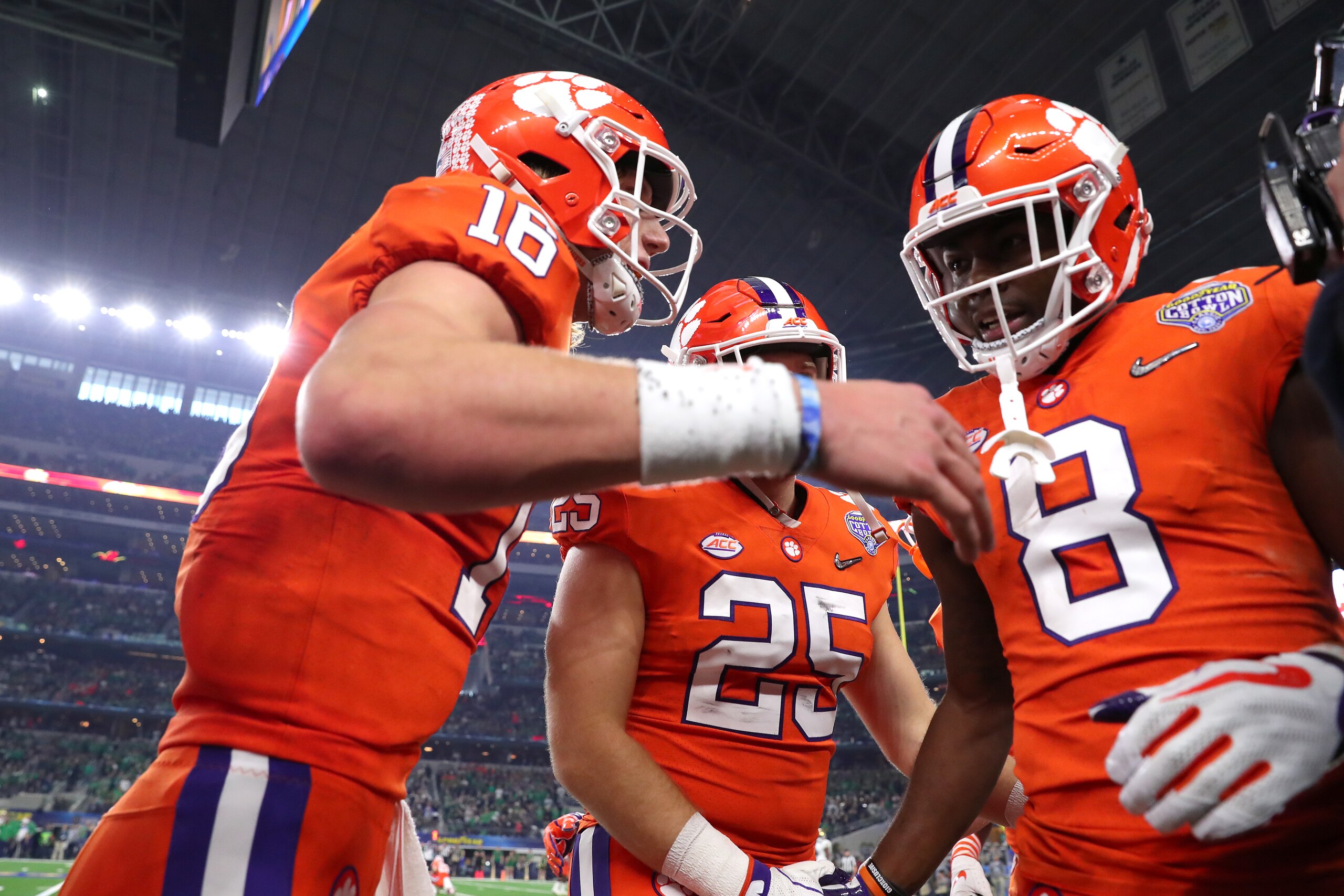 ARLINGTON, TEXAS - DECEMBER 29: Trevor Lawrence #16 and Justyn Ross #8 of the Clemson Tigers react after connecting on a 42 yard touchdown pass in the second quarter against the Notre Dame Fighting Irish during the College Football Playoff Semifinal Goody