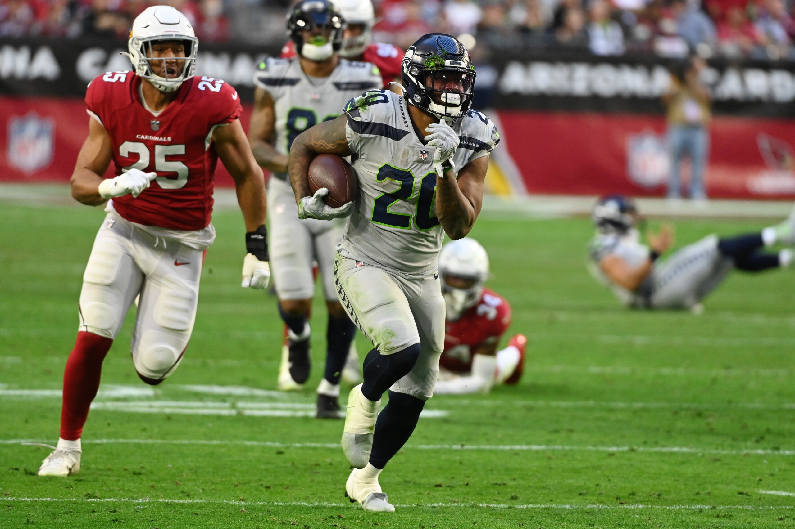 GLENDALE, ARIZONA - JANUARY 09: Rashaad Penny #20 of the Seattle Seahawks runs with the ball against the Arizona Cardinals at State Farm Stadium on January 09, 2022 in Glendale, Arizona. (Photo by Norm Hall/Getty Images) GLENDALE, ARIZONA - JANUARY 09: Rashaad Penny #20 of the Seattle Seahawks runs with the ball against the Arizona Cardinals at State Farm Stadium on January 09, 2022 in Glendale, Arizona. (Photo by Norm Hall/Getty Images)