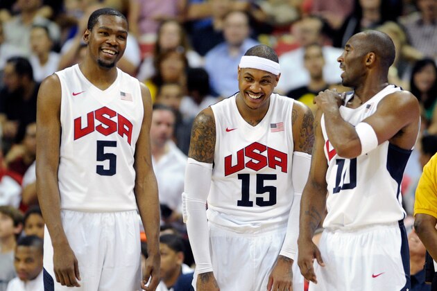 LAS VEGAS, NV - JULY 12:  Kevin Durant #5, Carmelo Anthony #15 and Kobe Bryant #10 of the US Men's Senior National Team chat on the sideline during a pre-Olympic exhibition game against the Dominican Republic at Thomas & Mack Center on July 12, 2012 in Las Vegas, Nevada. The United States won the game 113-59.  (Photo by David Becker/Getty Images)