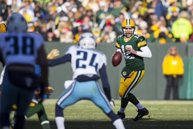 GREEN BAY, WI - DECEMBER 23: Aaron Rodgers #12 of the Green Bay Packers looks for a receiver against theTennessee Titans at Lambeau Field on December 23, 2012 in Green Bay, Wisconsin.  (Photo by Tom Lynn /Getty Images)