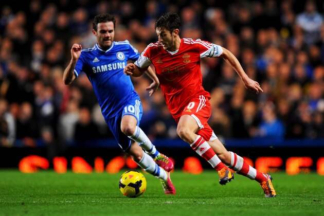LONDON, ENGLAND - DECEMBER 01:  Adam Lallana of Southampton evades Juan Mata of Chelsea during the Barclays Premier League match between Chelsea and Southampton at Stamford Bridge on December 1, 2013 in London, England.  (Photo by Mike Hewitt/Getty Images)