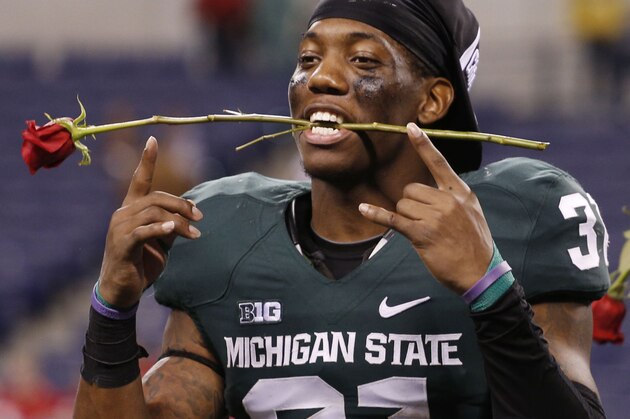 Dec 7, 2013; Indianapolis, IN, USA; Michigan State Spartans cornerback Darqueze Dennard (31) reacts after defeating the Ohio State Buckeyes during the Big 10 Championship game at Lucas Oil Stadium. Michigan State defeats Ohio State 34-24. Mandatory Credit: Brian Spurlock-USA TODAY Sports Dec 7, 2013; Indianapolis, IN, USA; Michigan State Spartans cornerback Darqueze Dennard (31) reacts after defeating the Ohio State Buckeyes during the Big 10 Championship game at Lucas Oil Stadium. Michigan State defeats Ohio State 34-24. Mandatory Credit: Brian Spurlock-USA TODAY Sports