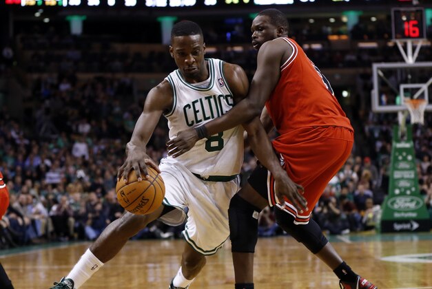 Feb 13, 2013; Boston, Massachusetts, USA; Boston Celtics forward Jeff Green (8) drives against Chicago Bulls small forward Luol Deng (9) during the fourth quarter at TD Banknorth Garden. The Boston Celtics won 71-69.  Mandatory Credit: Greg M. Cooper-USA TODAY Sports