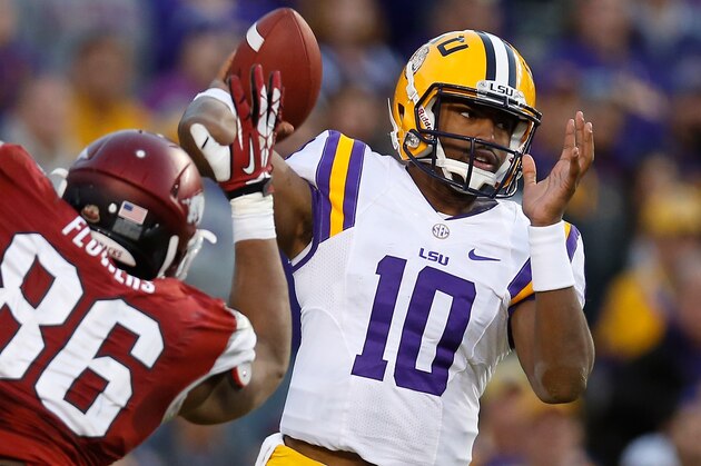 BATON ROUGE, LA - NOVEMBER 29:  Quarterback Anthony Jennings #10 of the LSU Tigers throws a pass against the  Arkansas Razorbacks at Tiger Stadium on November 29, 2013 in Baton Rouge, Louisiana.  (Photo by Chris Graythen/Getty Images)