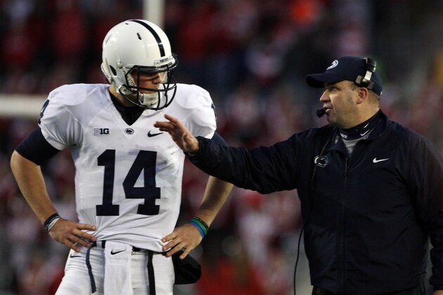 Nov 30, 2013; Madison, WI, USA; Penn State Nittany Lions head coach Bill O'Brien talks to quarterback Christian Hackenberg (14) during the game with the Wisconsin Badgers at Camp Randall Stadium. Penn State defeated Wisconsin 31-24. Mandatory Credit: Mary Langenfeld-USA TODAY Sports