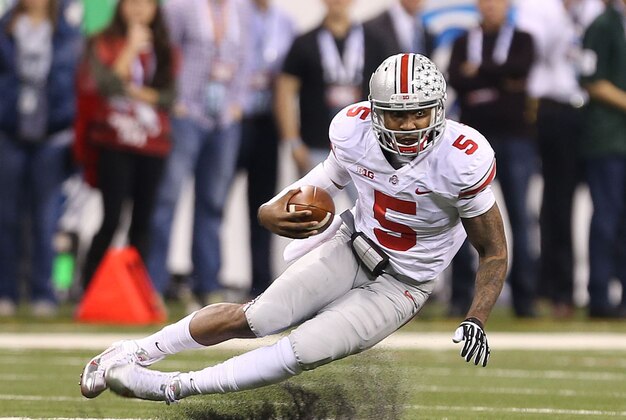 Dec 7, 2013; Indianapolis, IN, USA; Ohio State Buckeyes quarterback Braxton Miller (5) runs for a first down against the Michigan State Spartans during the Big Ten Championship game at Lucas Oil Stadium. Mandatory Credit: Brian Spurlock-USA TODAY Sports Dec 7, 2013; Indianapolis, IN, USA; Ohio State Buckeyes quarterback Braxton Miller (5) runs for a first down against the Michigan State Spartans during the Big Ten Championship game at Lucas Oil Stadium. Mandatory Credit: Brian Spurlock-USA TODAY Sports