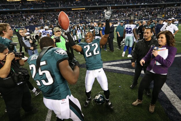 Dec 29, 2013; Arlington, TX, USA; Philadelphia Eagles cornerback Brandon Boykin (22) celebrates a victory with running back LeSean McCoy (25) against the Dallas Cowboys at AT&T Stadium. The Eagle beat the Cowboys 24-22. Mandatory Credit: Matthew Emmons-USA TODAY Sports