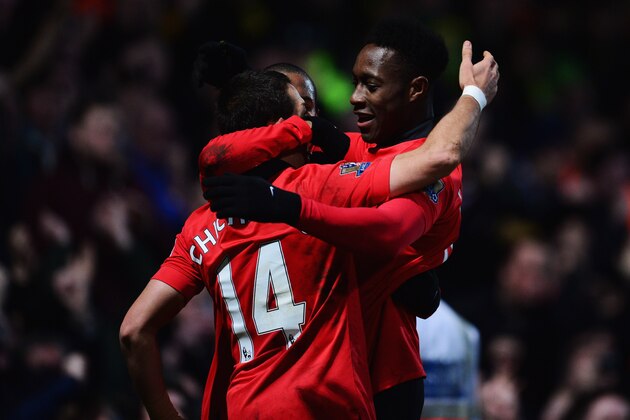 NORWICH, ENGLAND - DECEMBER 28:  Danny Welbeck of Manchester United (R) celebrates with Javier Hernandez (14) as he scores their first goal during the Barclays Premier League match between Norwich City and  Manchester United at Carrow Road on December 28, 2013 in Norwich, England.  (Photo by Jamie McDonald/Getty Images)
