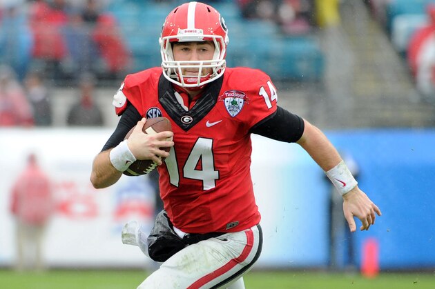 Jan 1, 2014; Jacksonville, FL, USA; Georgia Bulldogs quarterback Hutson Mason (14) runs the ball during the first half against the Nebraska Cornhuskers at EverBank Field . Mandatory Credit: Melina Vastola-USA TODAY Sports Jan 1, 2014; Jacksonville, FL, USA; Georgia Bulldogs quarterback Hutson Mason (14) runs the ball during the first half against the Nebraska Cornhuskers at EverBank Field . Mandatory Credit: Melina Vastola-USA TODAY Sports