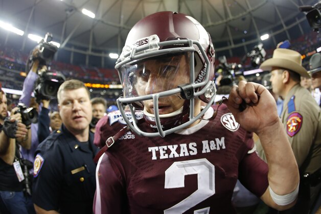 Dec 31, 2013; Atlanta, GA, USA; Texas A&M Aggies quarterback Johnny Manziel (2) celebrates defeating the Duke Blue Devils during the 2013 Chick-fil-A Bowl at the Georgia Dome. Texas A&M won 52-48. Mandatory Credit: Paul Abell-USA TODAY Sports