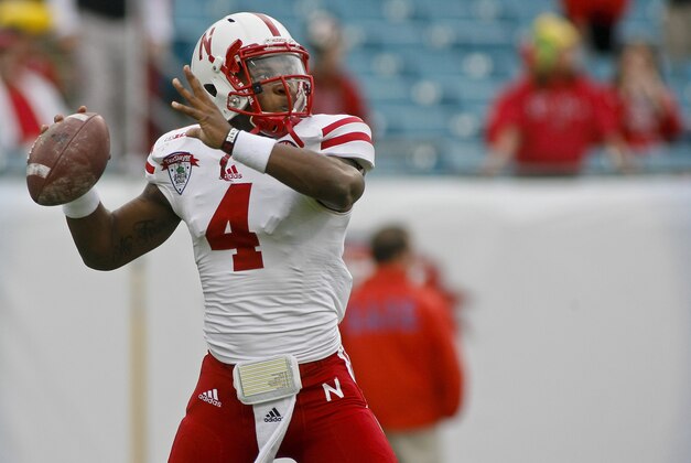 Jan 1, 2014; Jacksonville, FL, USA; Nebraska Cornhuskers quarterback Tommy Armstrong Jr. (4) throws a pass before the start of their game against the Georgia Bulldogs at EverBank Field . Mandatory Credit: Phil Sears-USA TODAY Sports