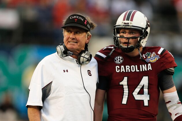 ORLANDO, FL - JANUARY 01:  Head coach Steve Spurrier of the South Carolina Gamecocks chats with his quarterback Connor Shaw #14 in the second half of their game against the Wisconsin Badgers at the Capital One Bowl on January 1, 2014 in Orlando, Florida.  (Photo by Scott Halleran/Getty Images)