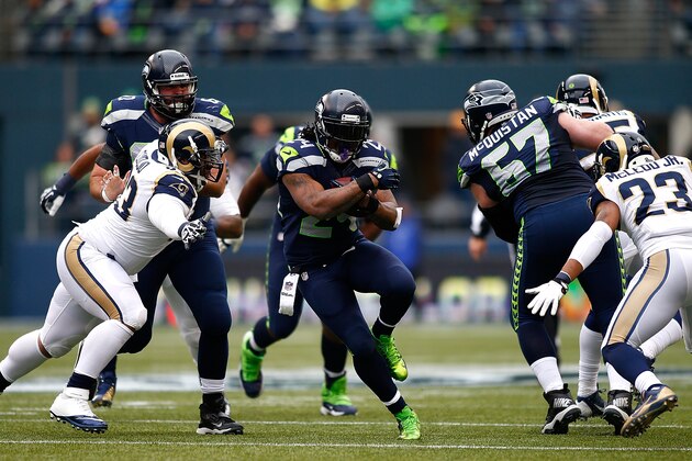 SEATTLE - DECEMBER 29:  Marshawn Lynch #24 runs the ball against the Seattle Seahawks of the St. Louis Rams on December 29, 2013 at CenturyLink Field in Seattle, Washington.  (Photo by Jonathan Ferrey/Getty Images)