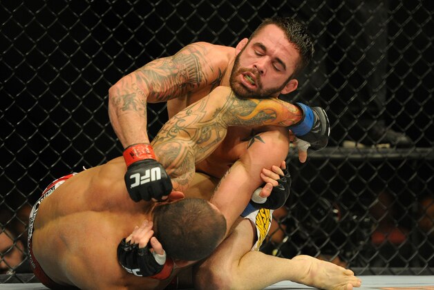 Aug 31, 2013; Milwaukee, WI, USA;  Jamie Varner(top) fights Gleison Tibau during the UFC-164 bout at BMO Harris Bradley Center. Mandatory Credit: Benny Sieu-USA TODAY Sports