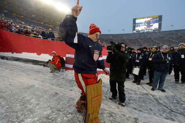ANN ARBOR, MI - JANUARY 01:  Goaltender Jimmy Howard #35 of the Detroit Red Wings acknowledges the stadium fans as he walks back to the ice surface after being selected to the U.S. Men's Nation Team for the 2014 Sochi Olympics after the 2014 Bridgestone NHL Winter Classic on January 1, 2014 at Michigan Stadium in Ann Arbor, Michigan. The Maple Leafs defeated the Red Wings 3-2 in shootout overtime.  (Photo by Brian Babineau/NHLI via Getty Images)