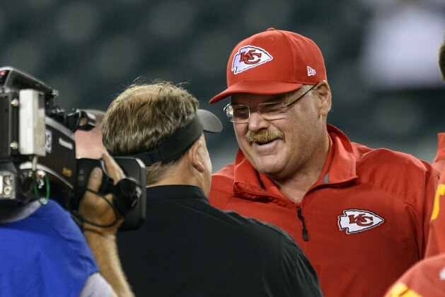 Sep 19, 2013; Philadelphia, PA, USA; Kansas City Chiefs head coach Andy Reid talks with Philadelphia Eagles head coach Chip Kelly  during warmups at Lincoln Financial Field. The Chiefs defeated the Eagles 26-16. Mandatory Credit: Howard Smith-USA TODAY Sports