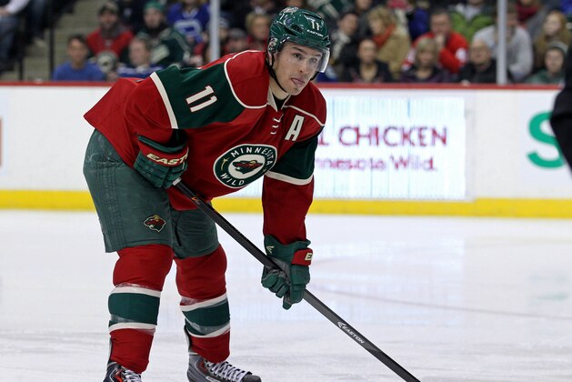 Dec 17, 2013; Saint Paul, MN, USA; Minnesota Wild forward Zach Parise (11) against the Vancouver Canucks at Xcel Energy Center. The Wild defeated the Canucks 3-2 in a shootout. Mandatory Credit: Brace Hemmelgarn-USA TODAY Sports