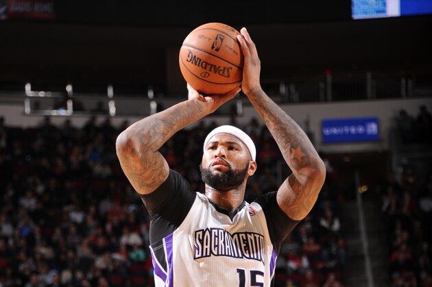 HOUSTON, TX - DECEMBER 31: DeMarcus Cousins #15 of the Sacramento Kings shoots against the Houston Rockets on December 31, 2013 at the Toyota Center in Houston, Texas. NOTE TO USER: User expressly acknowledges and agrees that, by downloading and or using this photograph, User is consenting to the terms and conditions of the Getty Images License Agreement. Mandatory Copyright Notice: Copyright 2013 NBAE (Photo by Bill Baptist/NBAE via Getty Images)
