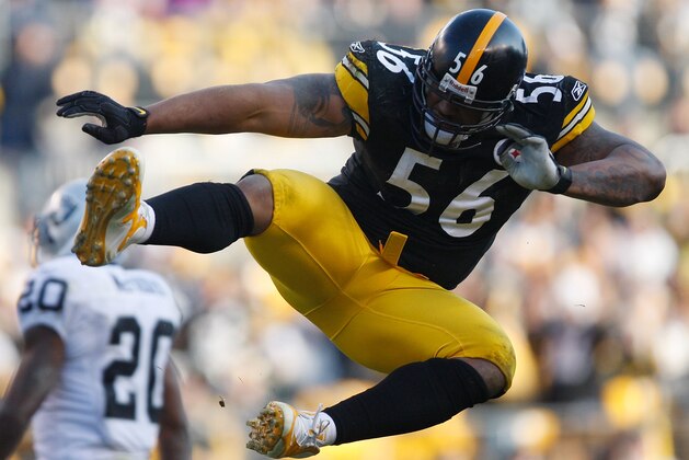 PITTSBURGH - DECEMBER 6: LaMarr Woodley #56 of the Pittsburgh Steelers celebrates after sacking Bruce Gadkowski #5 of the Oakland Raiders during the game on December 6, 2009 at Heinz Field in Pittsburgh, Pennsylvania. (Photo by Jared Wickerham/Getty Images)