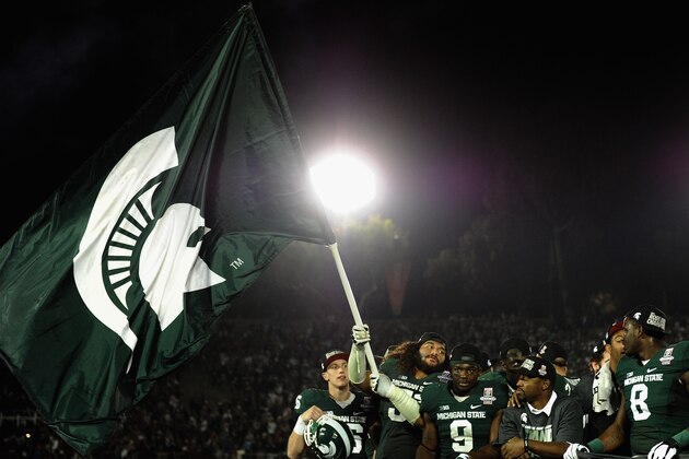 PASADENA, CA - JANUARY 01:  Offensive tackle Fou Fonoti #51 of the Michigan State Spartans celebrates after the Spartans defeat the Stanford Cardinal 24-20 in the 100th Rose Bowl Game presented by Vizio at the Rose Bowl on January 1, 2014 in Pasadena, California.  (Photo by Harry How/Getty Images)