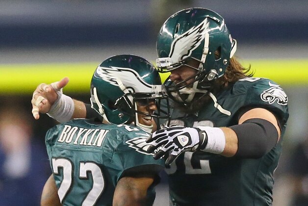 ARLINGTON, TX - DECEMBER 29:  (L-R) Brandon Boykin #22 of the Philadelphia Eagles celebrates his pass interception with Jason Kelce #62 in the fourth quarter against the Dallas Cowboys at Cowboys Stadium on December 29, 2013 in Arlington, Texas.  (Photo by Ronald Martinez/Getty Images)