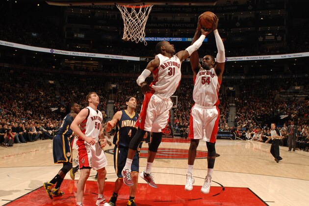TORONTO, CANADA - January 1: Patrick Patterson #54 of the Toronto Raptors grabs a rebound against the Indiana Pacers on January 1, 2014 at the Air Canada Centre in Toronto, Ontario, Canada.  NOTE TO USER: User expressly acknowledges and agrees that, by downloading and or using this Photograph, user is consenting to the terms and conditions of the Getty Images License Agreement.  Mandatory Copyright Notice: Copyright 2014 NBAE (Photo by Ron Turenne/NBAE via Getty Images)