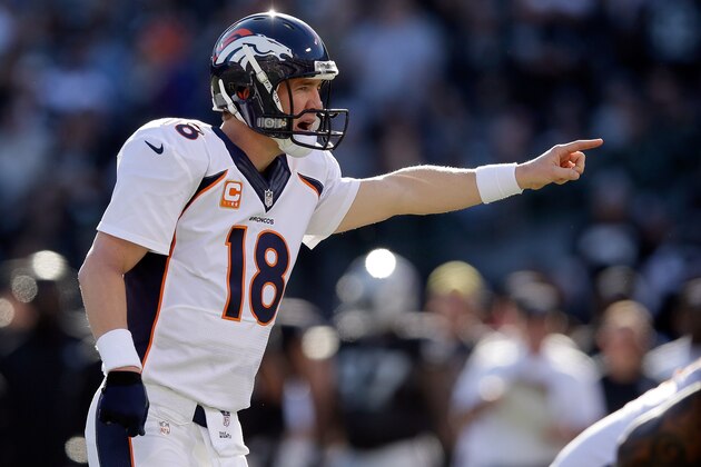 OAKLAND, CA - DECEMBER 29:  Peyton Manning #18 of the Denver Broncos shots instructions to his team during their game against the Oakland Raiders at O.co Coliseum on December 29, 2013 in Oakland, California.  (Photo by Ezra Shaw/Getty Images)