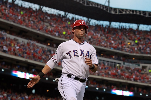 ARLINGTON, TX - APRIL 07:  Michael Young #10 of the Texas Rangers celebrates a run against the Chicago White Sox at Rangers Ballpark in Arlington on April 7, 2012 in Arlington, Texas.  (Photo by Ronald Martinez/Getty Images)