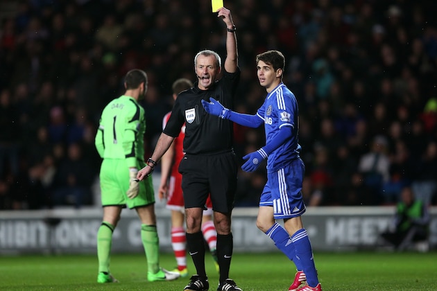 SOUTHAMPTON, ENGLAND - JANUARY 01:  Oscar of Chelsea is shown a yellow card by Referee Martin Atkinson for diving during the Barclays Premier League match between Southampton and Chelsea at St Mary's Stadium on January 1, 2014 in Southampton, England.  (Photo by Warren Little/Getty Images)