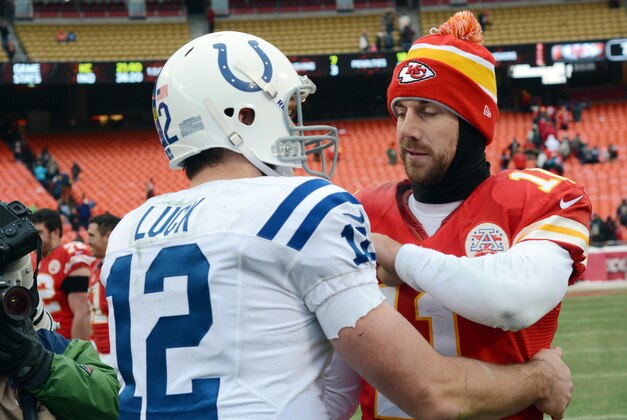 Dec 22, 2013; Kansas City, MO, USA; Kansas City Chiefs quarterback Alex Smith (11) congratulates Indianapolis Colts quarterback Andrew Luck (12) after the game at Arrowhead Stadium. The Colts won 23-7. Mandatory Credit: Denny Medley-USA TODAY Sports