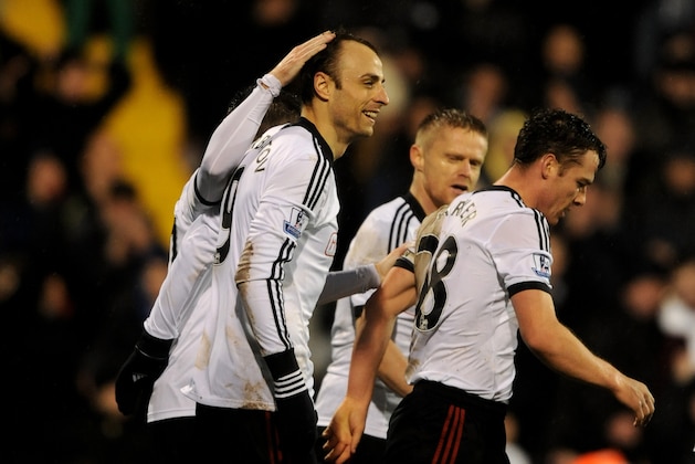 LONDON, ENGLAND - JANUARY 01:  Dimitar Berbatov (L) of Fulham is congratulated by teammates after scoring his team's second goal during the Barclays Premier League match between Fulham and West Ham United at Craven Cottage on January 1, 2014 in London, England.  (Photo by Steve Bardens/Getty Images)