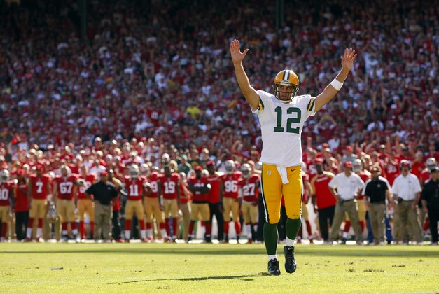 Sep 8, 2013; San Francisco, CA, USA; Green Bay Packers quarterback Aaron Rodgers (12) reacts after running back Eddie Lacy (not pictured) scored a touchdown against the San Francisco 49ers in the fourth quarter at Candlestick Park. The 49ers defeated the Packers 34-28. Mandatory Credit: Cary Edmondson-USA TODAY Sports
