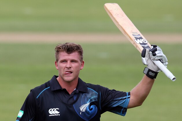 QUEENSTOWN, NEW ZEALAND - JANUARY 01:  Corey Anderson of New Zealand celebrates scoring the fastest 100 runs in history during game three of the One Day International Series between New Zealand and the West Indies at Queenstown Events Centre on January 1, 2014 in Queenstown, New Zealand.  (Photo by Rob Jefferies/Getty Images)
