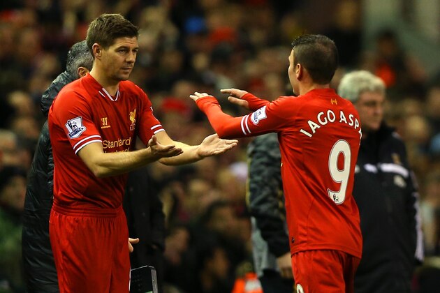 LIVERPOOL, ENGLAND - JANUARY 01:  Steven Gerrard of Liverpool replaces Iago Aspas of Liverpool during the Barclays Premier League match between Liverpool and Hull City at Anfield on January 1, 2014 in Liverpool, England.  (Photo by Clive Brunskill/Getty Images)