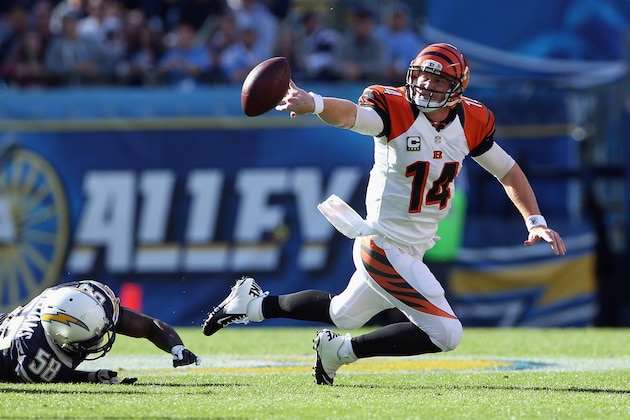 SAN DIEGO, CA - DECEMBER 02:  Quarterback Andy Dalton #14 of the Cincinnati Bengals tosses the ball after being tackled by linebacker Demorrio Williams #58 of the San Diego Chargers at Qualcomm Stadium on December 2, 2012 in San Diego, California.  (Photo by Jeff Gross/Getty Images)