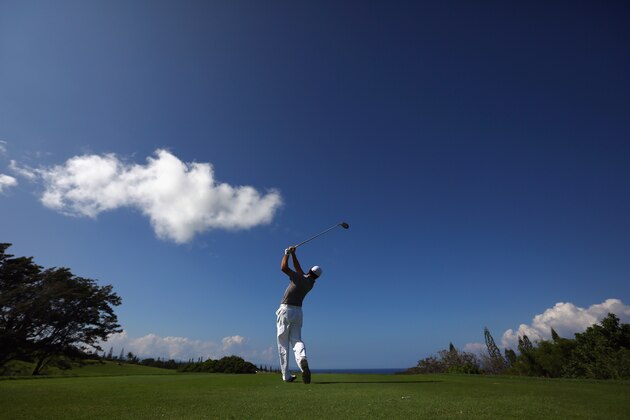 LAHAINA, HI - JANUARY 01:  Gary Woodland hits a tee shot during a practice round prior to the Hyundai Tournament of Champions at the Plantation Course at Kapalua Golf Club on January 1, 2014 in Lahaina, Hawaii.  (Photo by Tom Pennington/Getty Images)