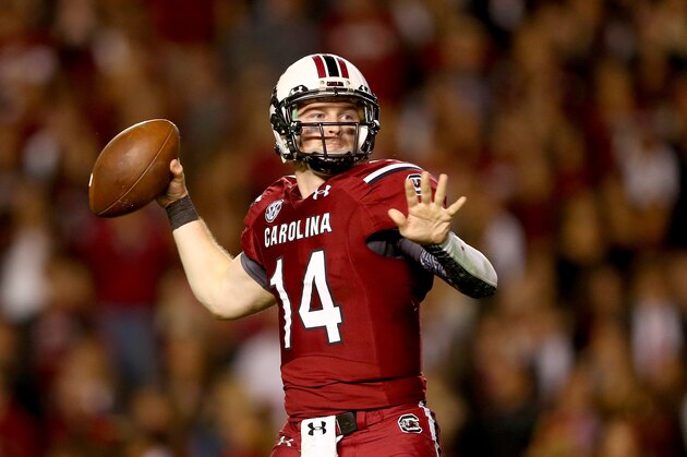 COLUMBIA, SC - NOVEMBER 16:  Connor Shaw #14 of the South Carolina Gamecocks drops back to pass against the Florida Gators during their game at Williams-Brice Stadium on November 16, 2013 in Columbia, South Carolina.  (Photo by Streeter Lecka/Getty Images)