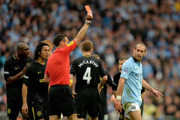LONDON, ENGLAND - MAY 11:  Pablo Zabaleta of Manchester City (R) is sent off by referee Andre Marriner during the FA Cup with Budweiser Final between Manchester City and Wigan Athletic at Wembley Stadium on May 11, 2013 in London, England.  (Photo by Shaun Botterill/Getty Images)
