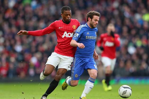 MANCHESTER, ENGLAND - MARCH 10:  Juan Mata of Chelsea competes with Patrice Evra of Manchester United during the FA Cup sponsored by Budweiser Sixth Round match between Manchester United and Chelsea at Old Trafford on March 10, 2013 in Manchester, England.  (Photo by Alex Livesey/Getty Images)