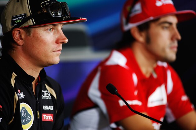 BUDAPEST, HUNGARY - JULY 26:  (L-R) Kimi Raikkonen of Finland and Lotus and Fernando Alonso of Spain and Ferrari  attend the drivers press conference during previews to the Hungarian Formula One Grand Prix at the Hungaroring on July 26, 2012 in Budapest, Hungary.  (Photo by Drew Gibson/Getty Images)